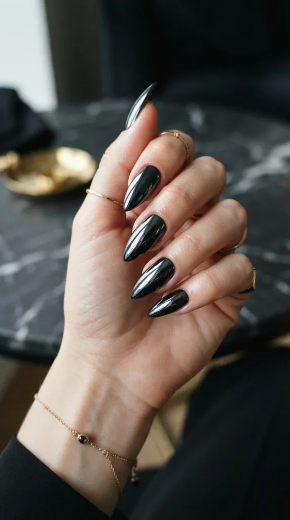 10. Black Chrome Statement Nails